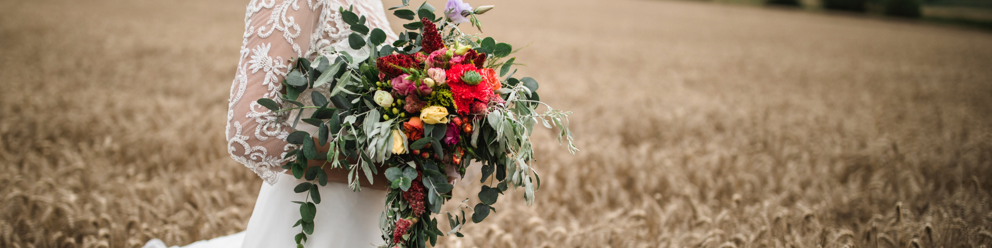 bride holding colorful bouquet