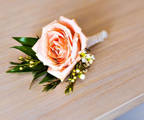 pink rose boutonniere 